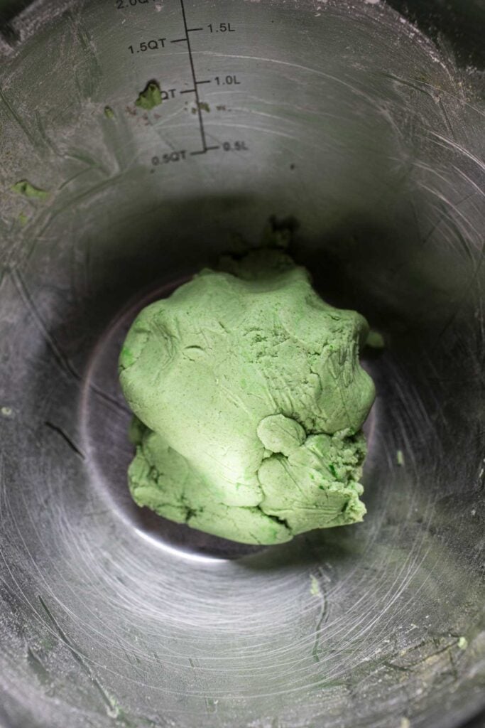 Green dough in a bowl. 