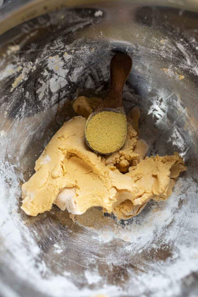 Yellow dough in a bowl. 