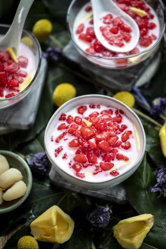 Bowls of red ruby dessert on a table.