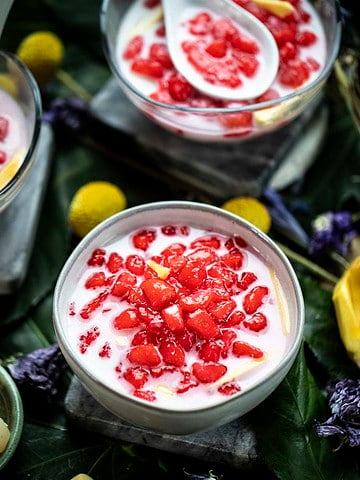 Red rubies dessert in a white bowl.