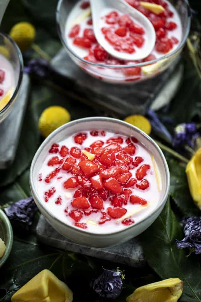 Thai Red rubies dessert in a white bowl.
