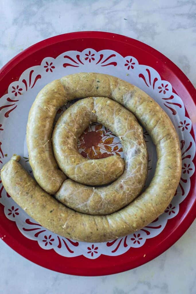 Sausage coiled on a plate.