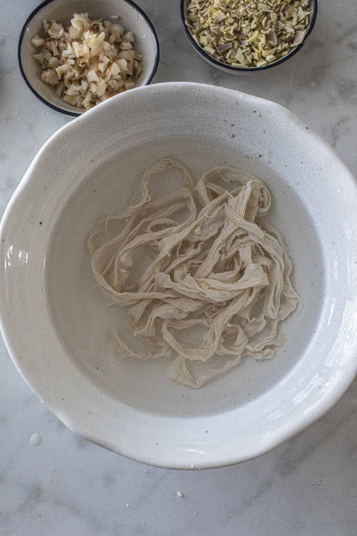 Sausage casing soaking in a bowl.