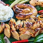 Sliced and whole Sai Oua Sausage on a platter.