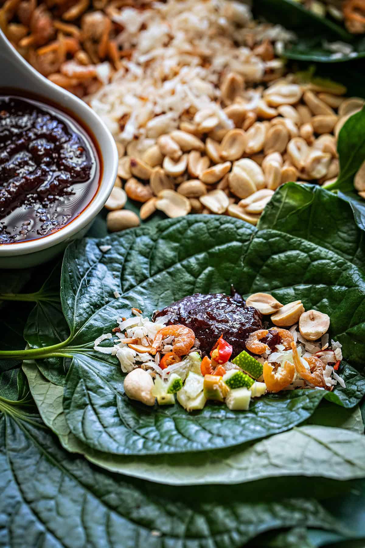 Thai Miang Kham ingredients on a betel leaf.