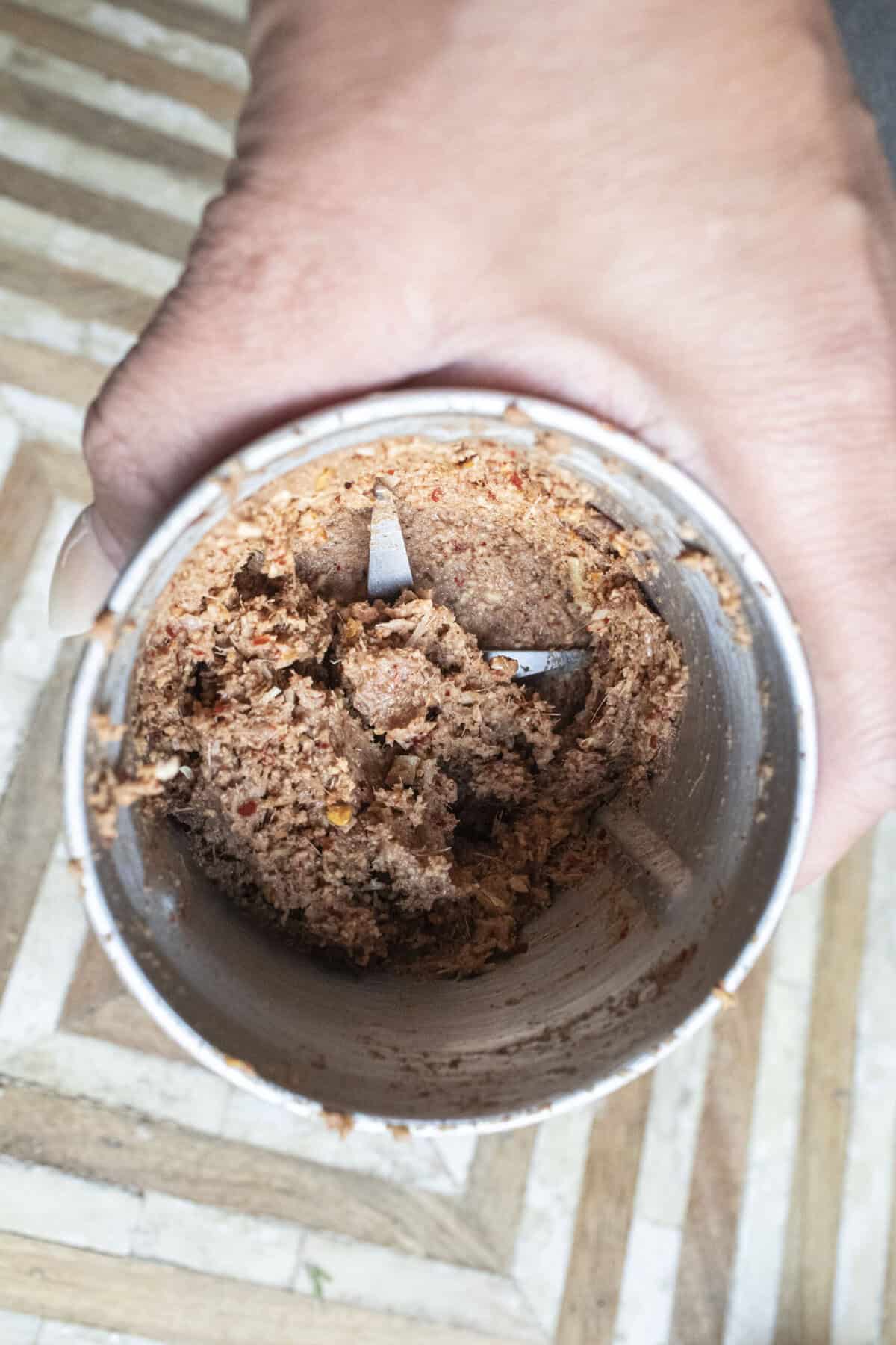 Paste in a spice grinder. 