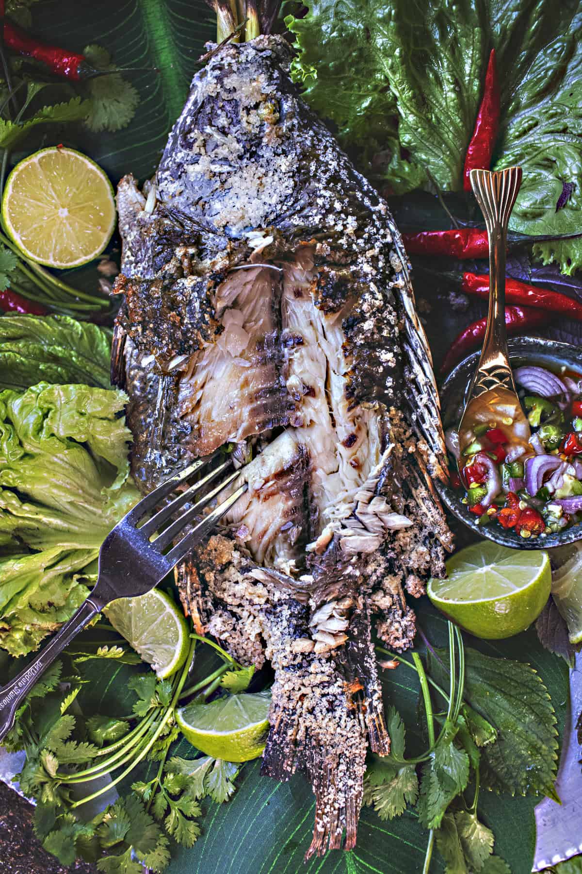 Fork lifiting fish meat.