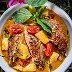 Thai roasted duck curry with pineapple in a bowl.