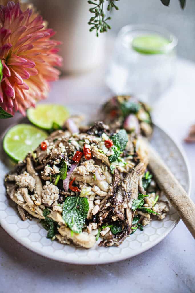mushroom larb salad on a plate on the table. 