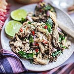 Oyster mushroom larb salad on a plate on the table.