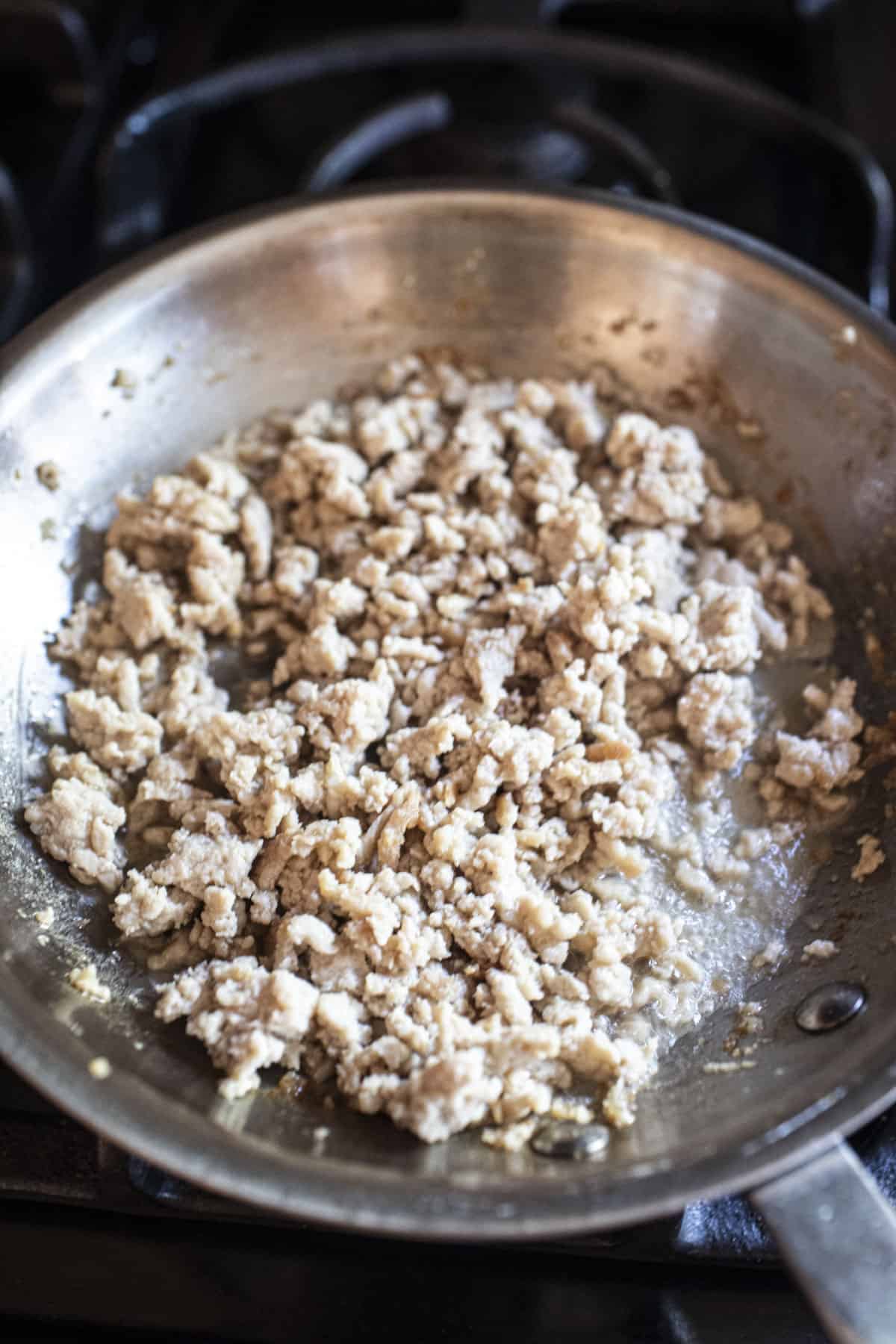 cooked ground meat in a pan.