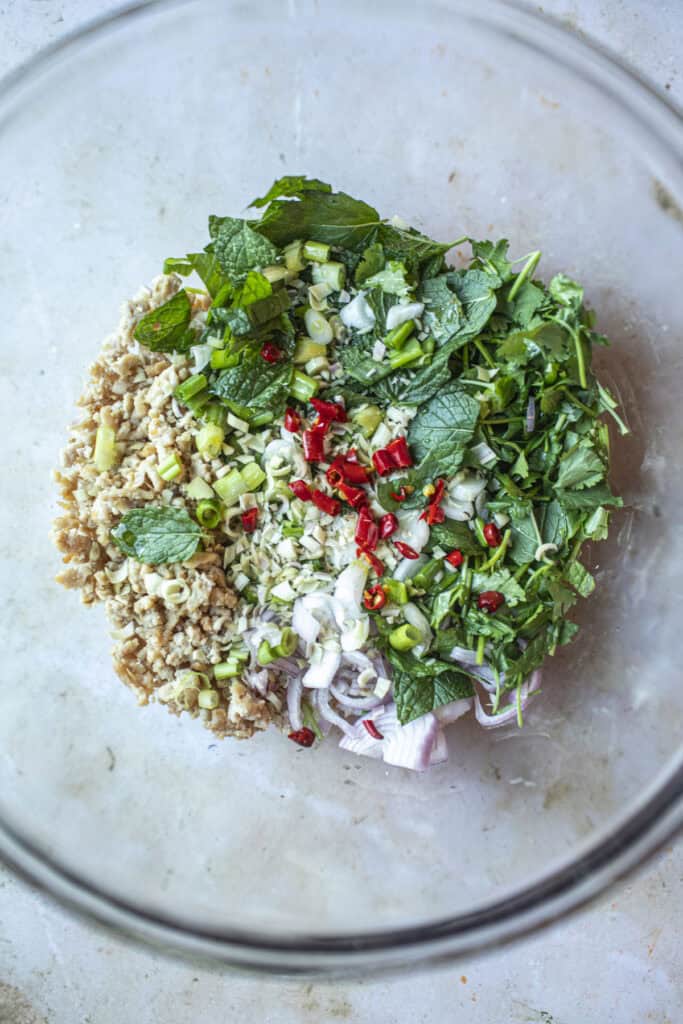 groud meat in a bowl with herbs. 