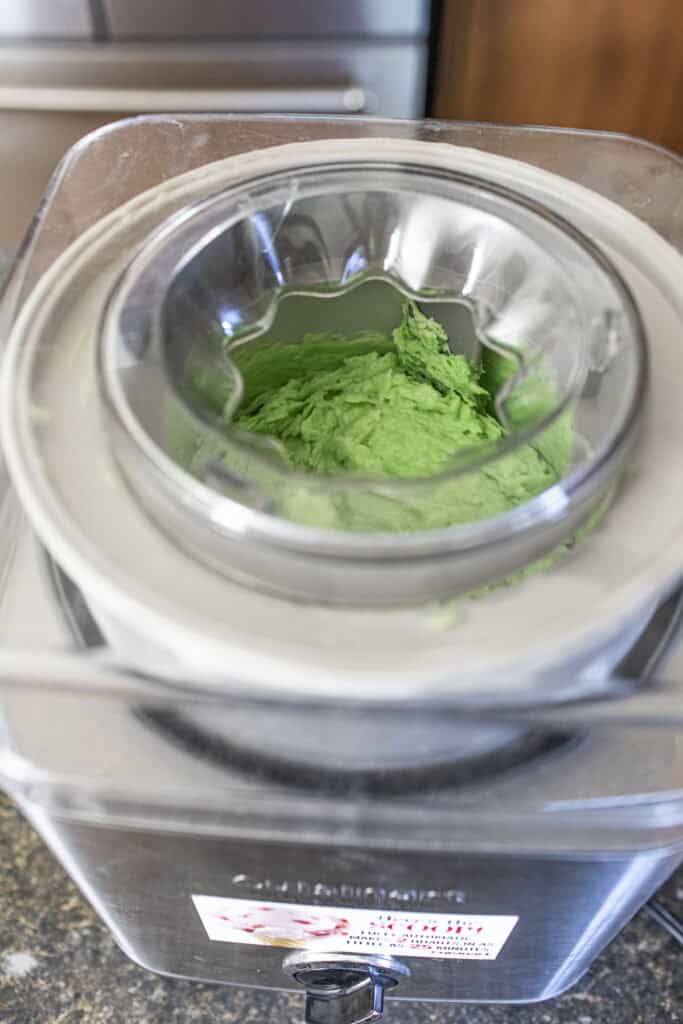 Green ice cream in an ice cream machine. 