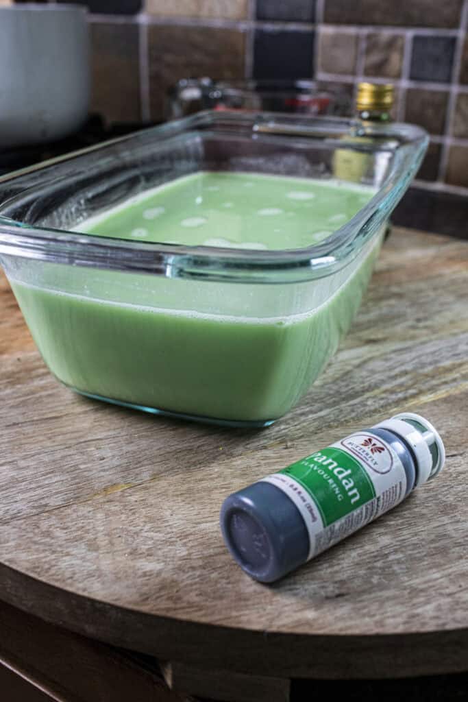 Green liquid in a glass bowl. 