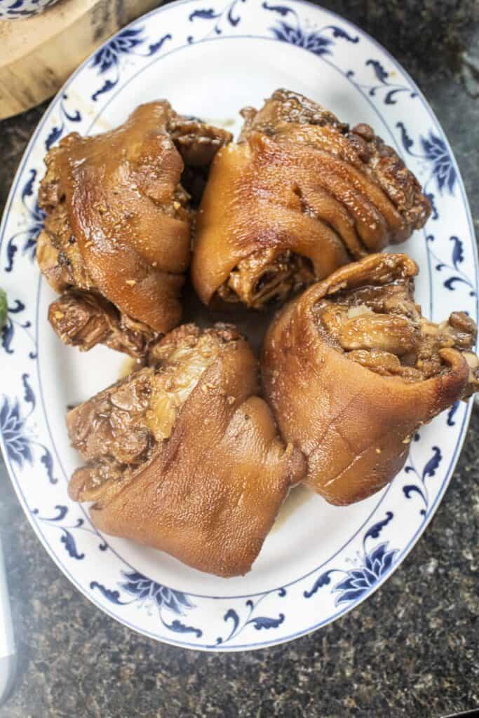 Cooked pork hocks on a plate.