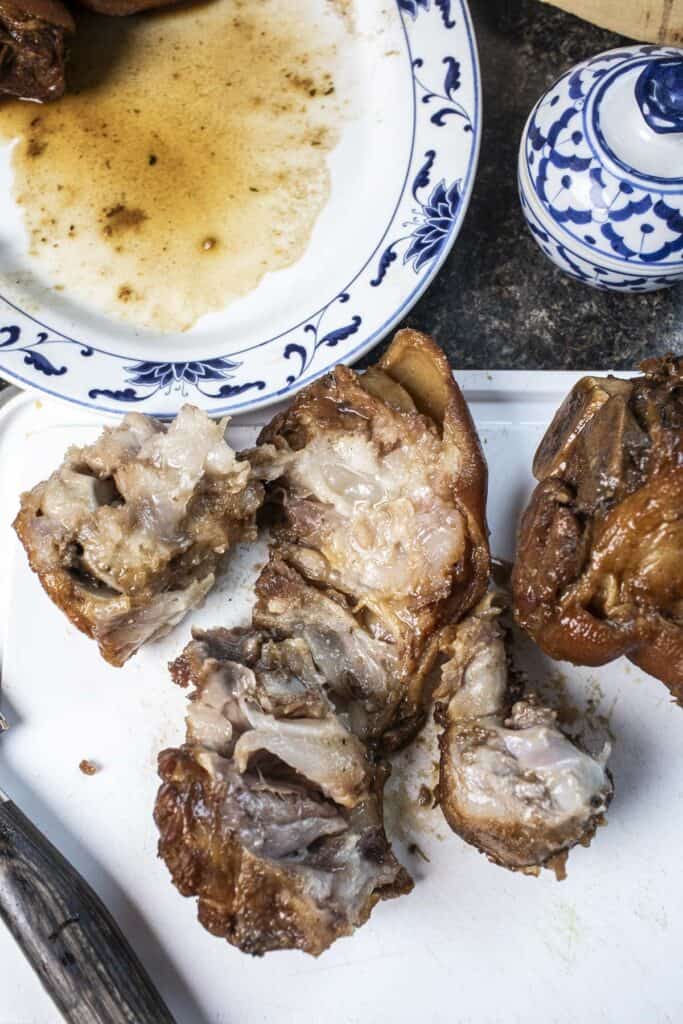 Cooked Pork hocks on a cutting board. 