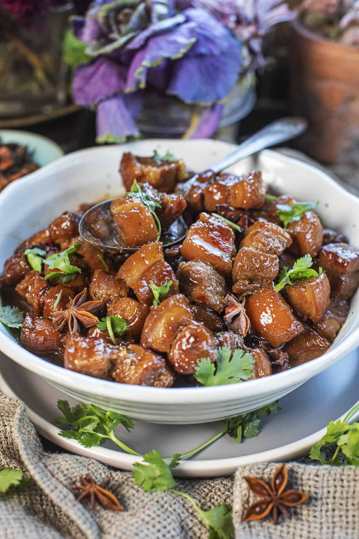 Moo hong stew in a bowl with a spoon in the middle.