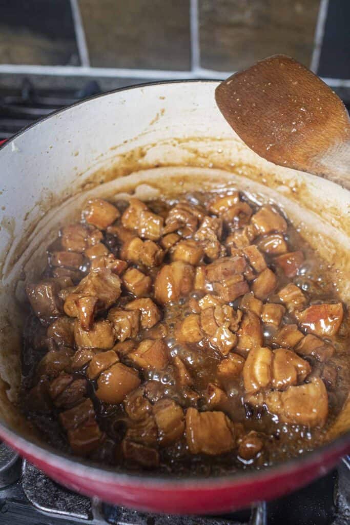 Pork belly cubes in a dutch oven.