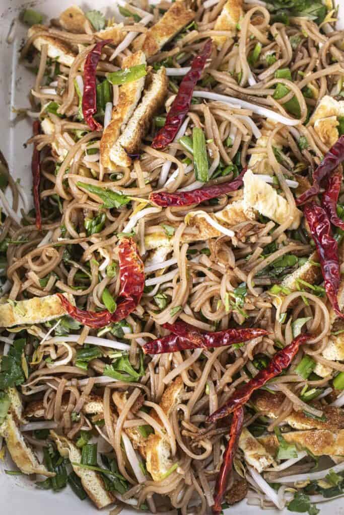Kua Mee stir-fried lao noodles in a tray. 