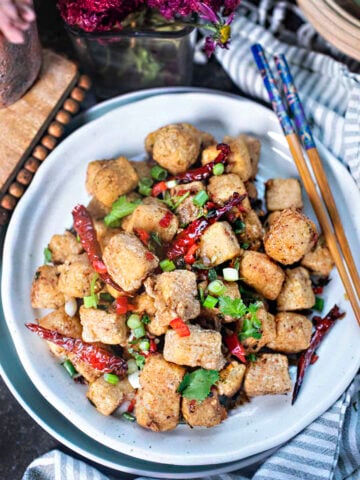 Salt and pepper tofu is a simple, Asian appetizer with a crispy outside and tender inside. Lightly seasoned with salt, pepper, and aromatic five spices, it’s ideal as a snack, party appetizer, or side dish to round out your meal.