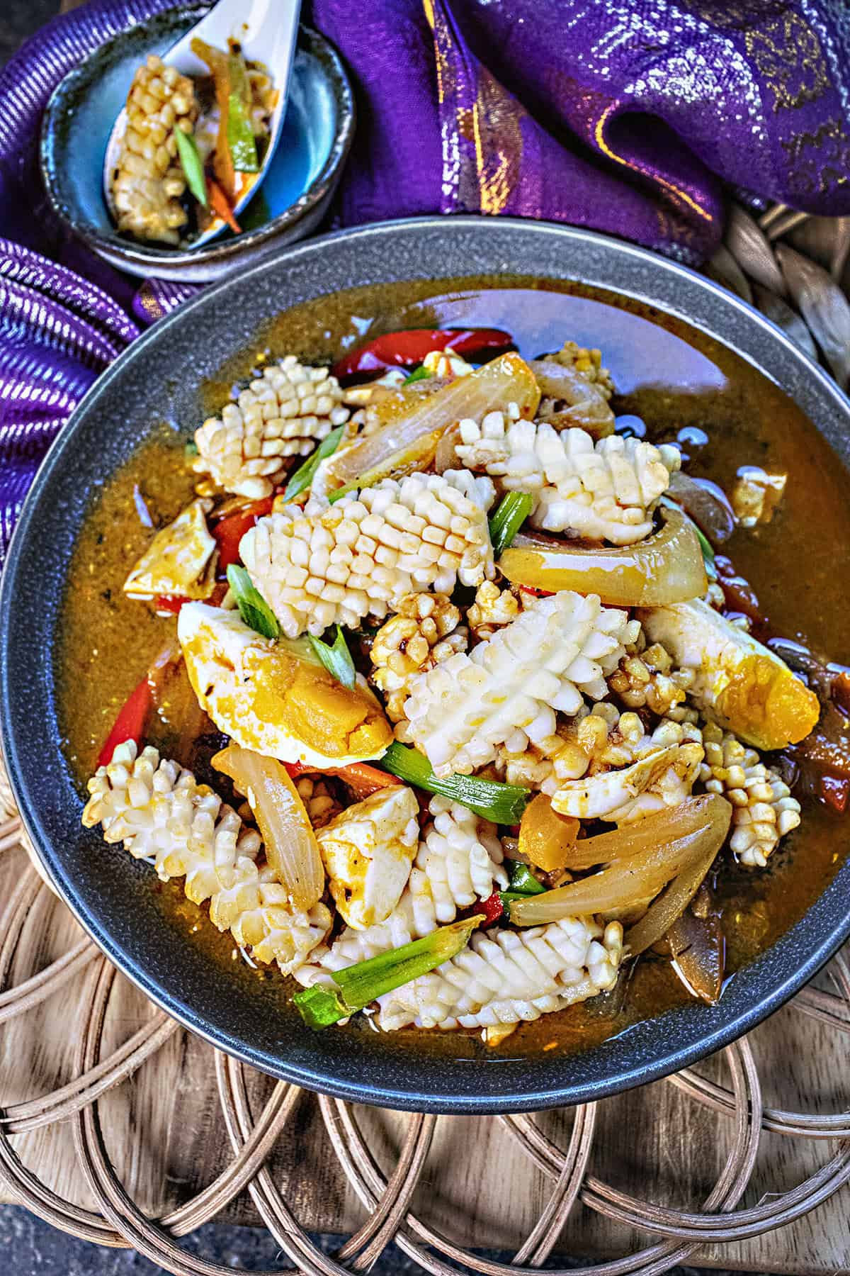 thai salted egg squid stir fry on a plate.