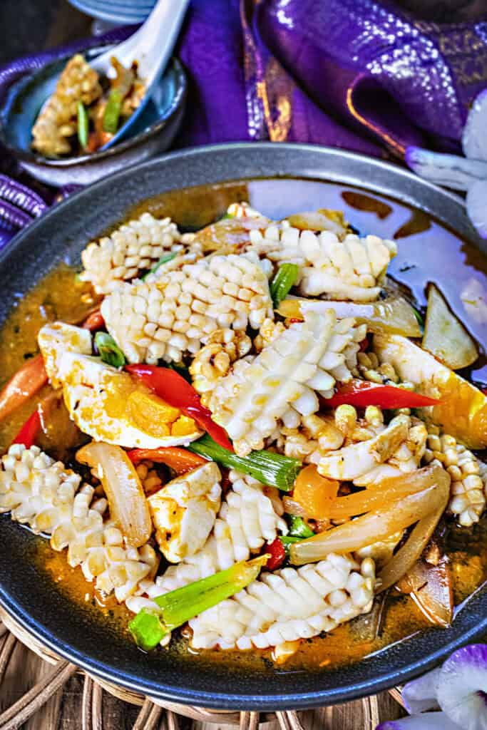 Thai salted egg squid stir fry on a plate. 