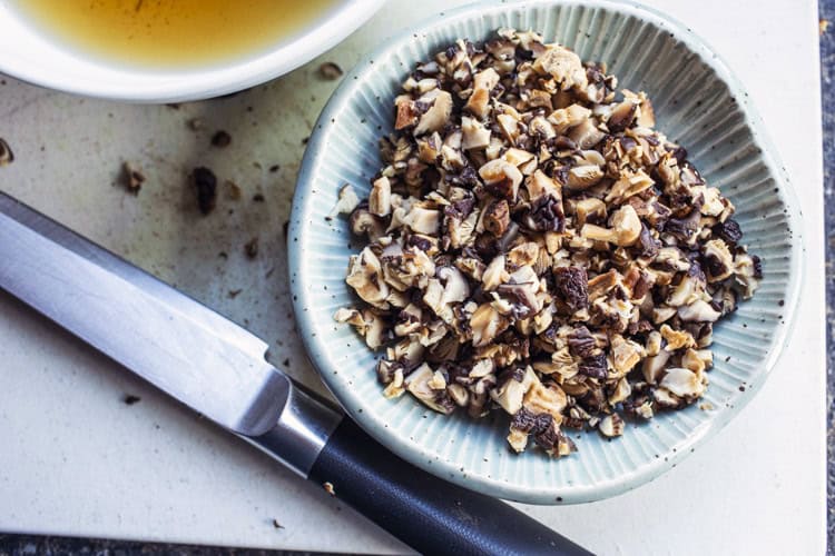 sliced shitake musrhoom in a bowl. 