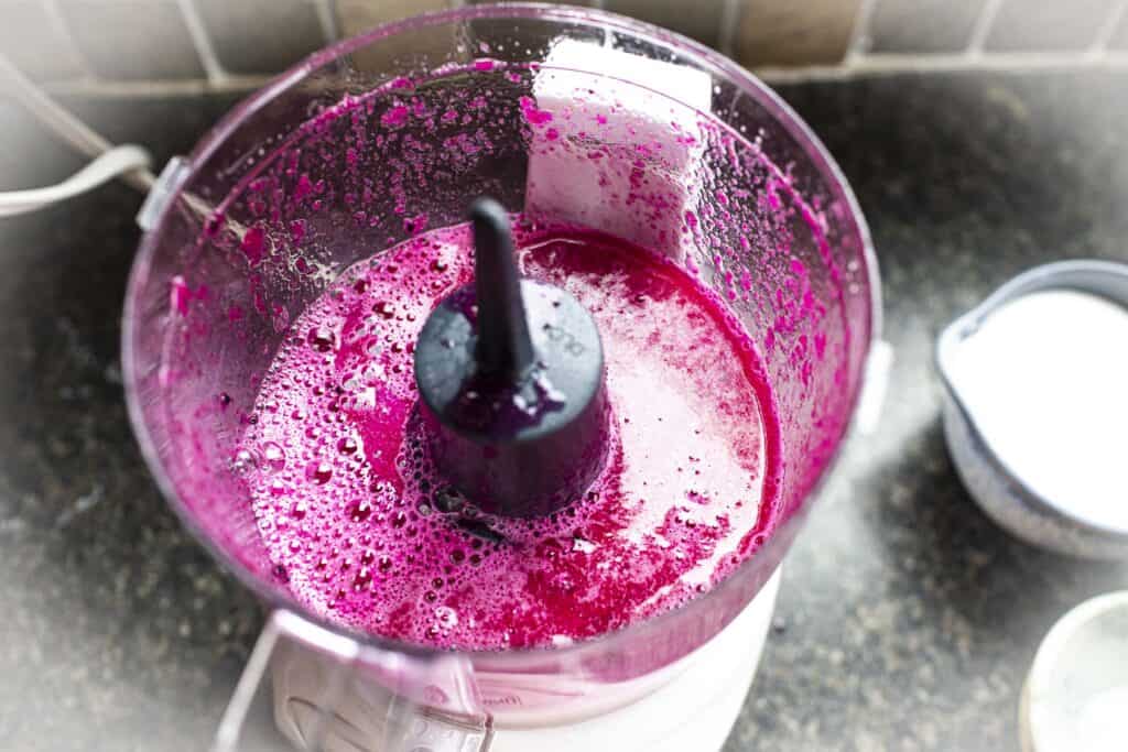 Dragon fruit puree in a food processor.