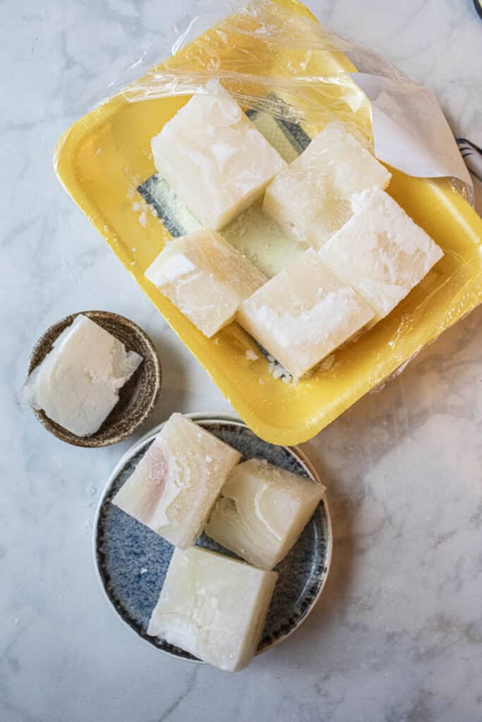 cubed tripe on a tray on the table. 