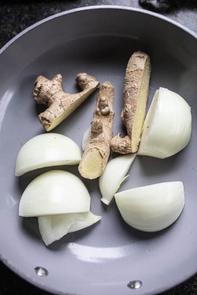 Onion and ginger in a pan.