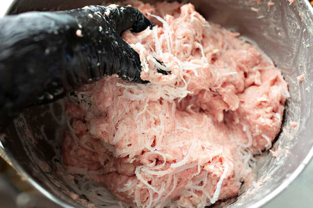 Ground pork with pork skin. 