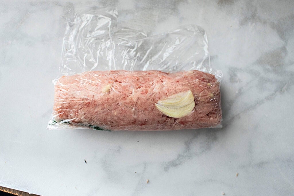 Saran Wrapped lao sausage. 