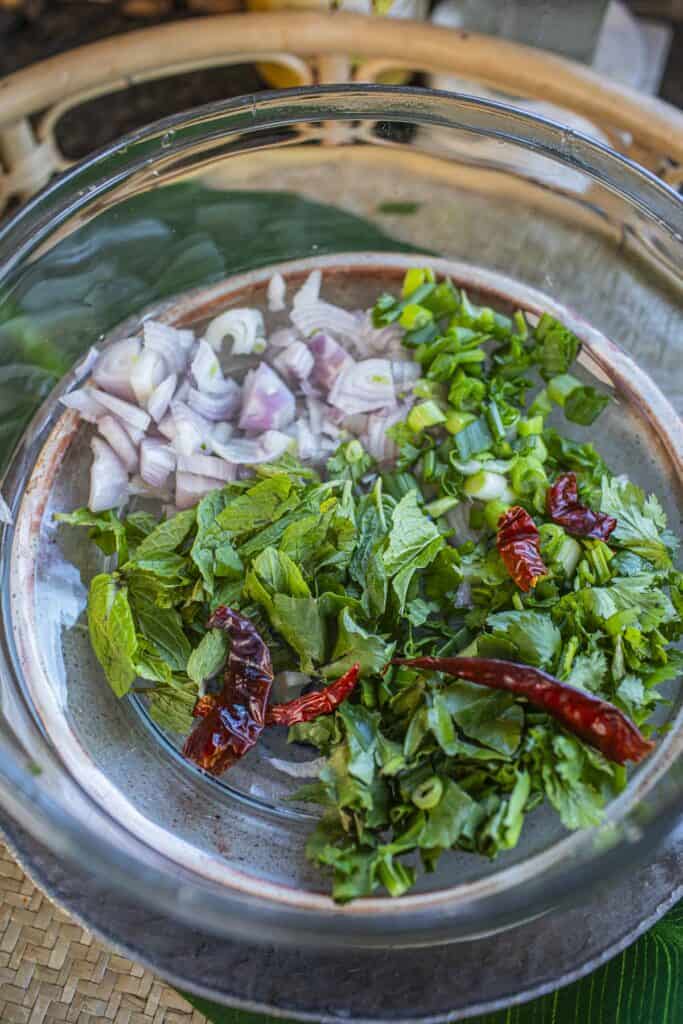 Thai crispy rice salad herbs in a bowl. 