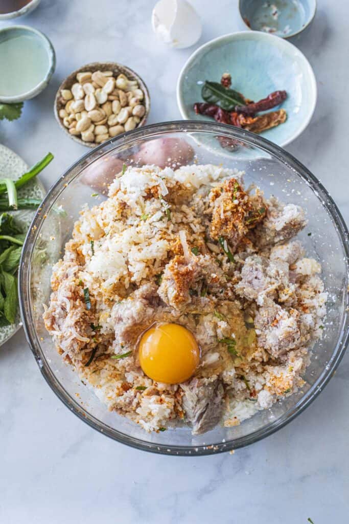 Nam khao recipe ingredients in a bowl. 
