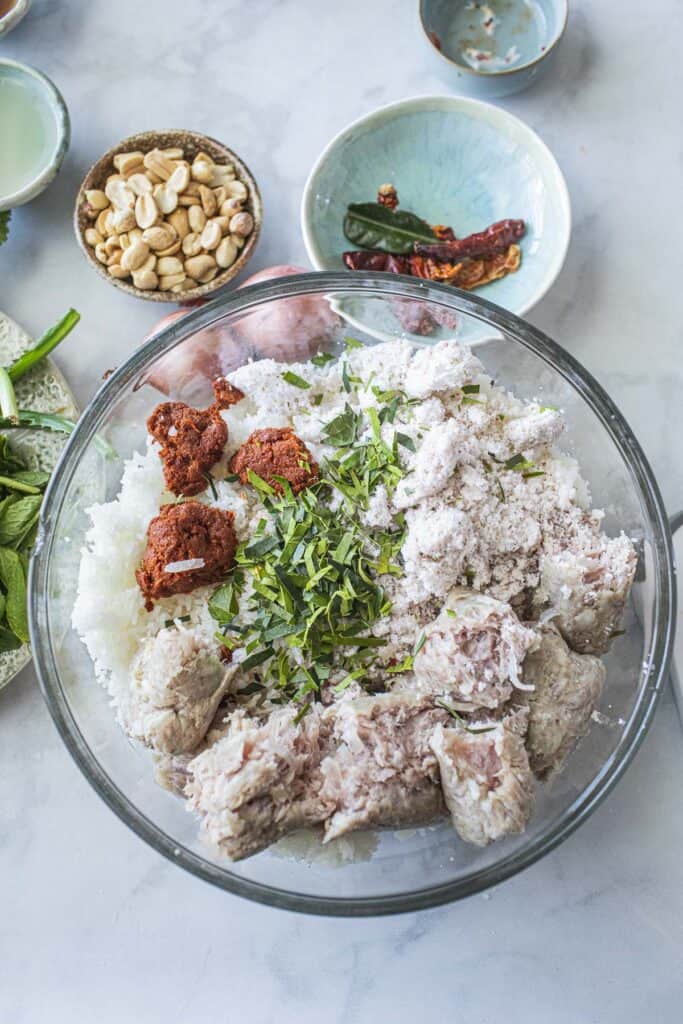 yam naem khao tod mixture in a bowl. 