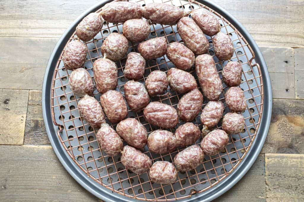 Thai fermented sausage links on a tray on the table. 