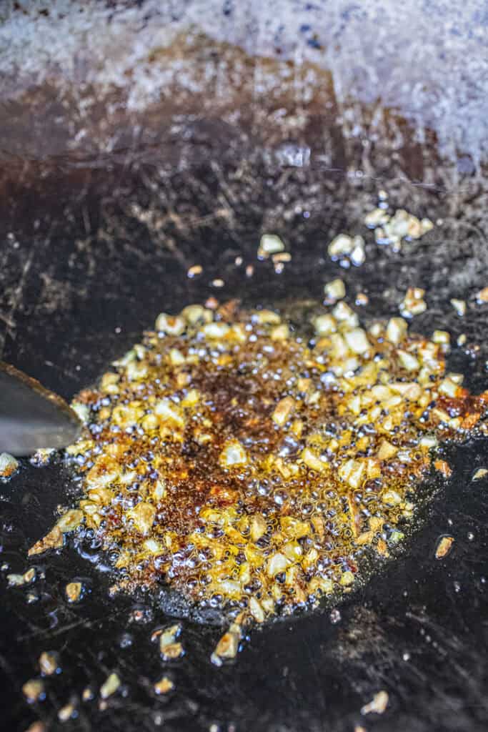 Fried chili in oil in a wok. 