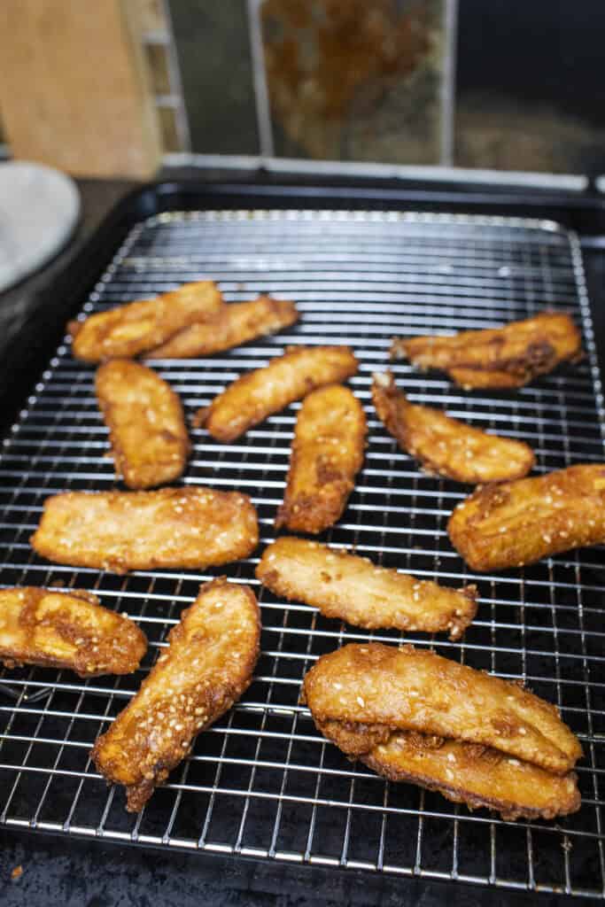 thai fried bananas on a baking rack.