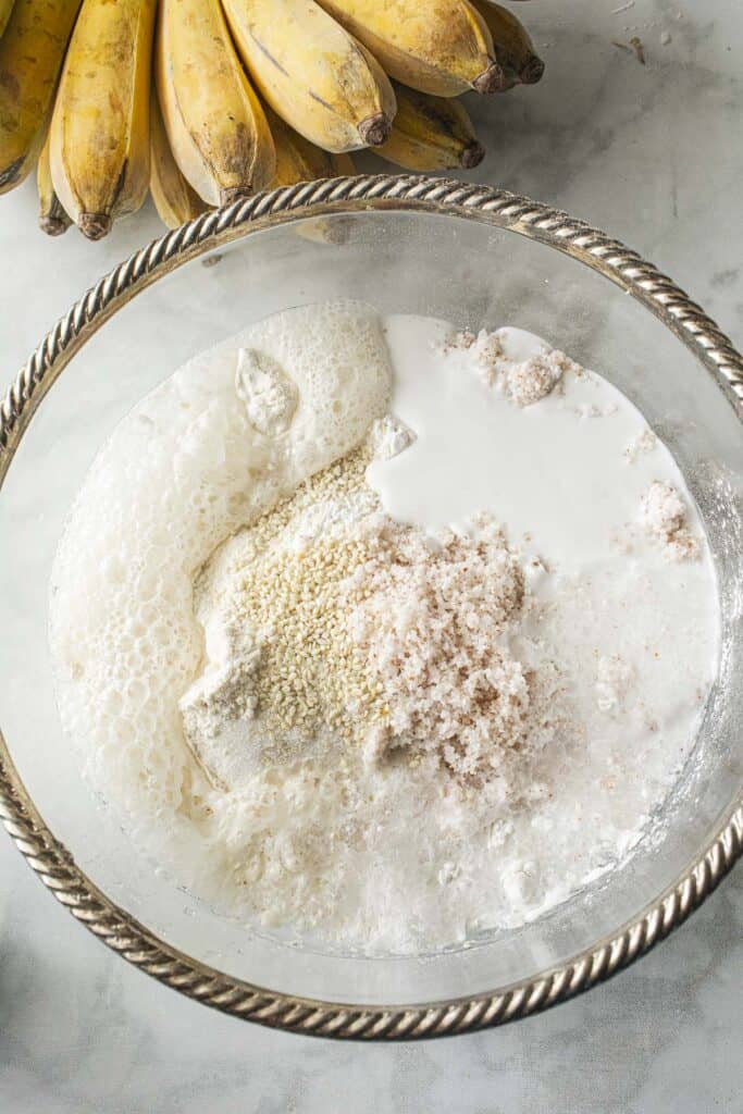 flour and ingredients for banana batter in a bowl. 