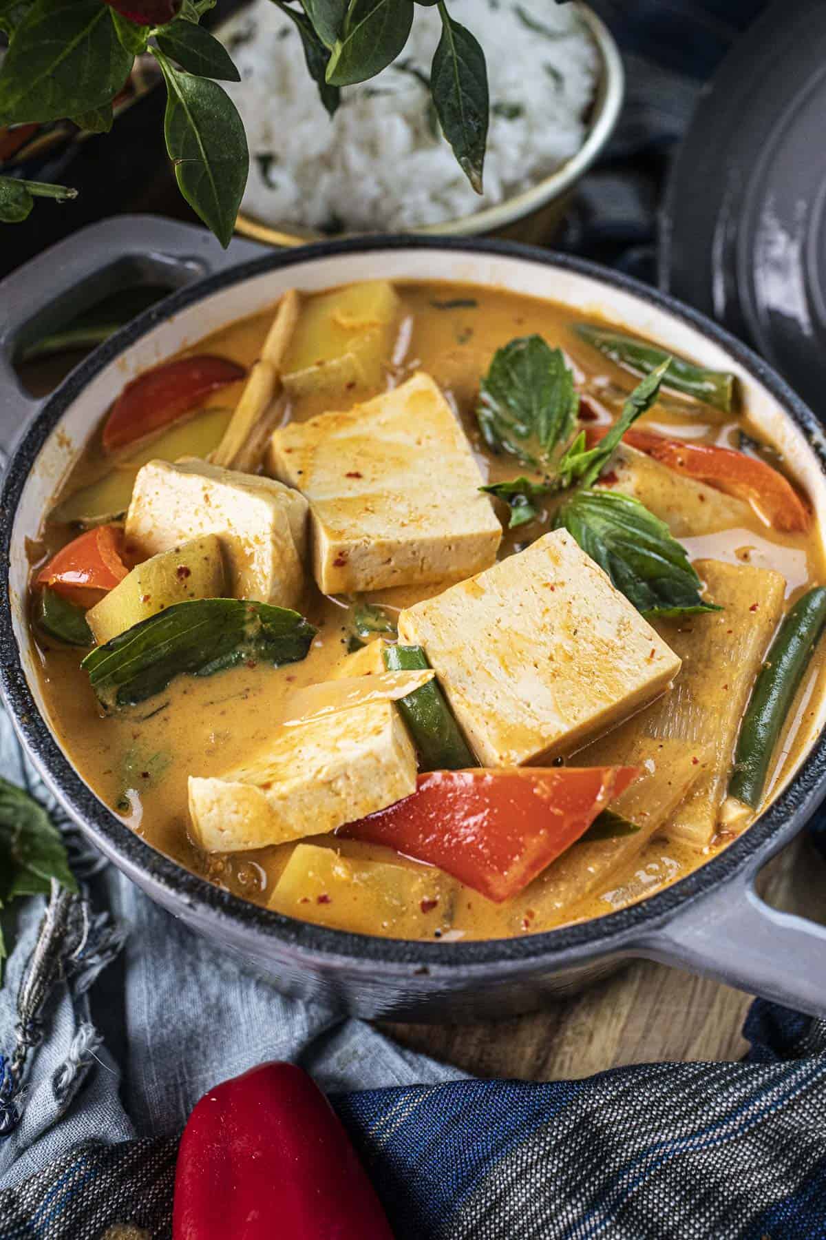 Thai red curry with vegetables in a bowl.