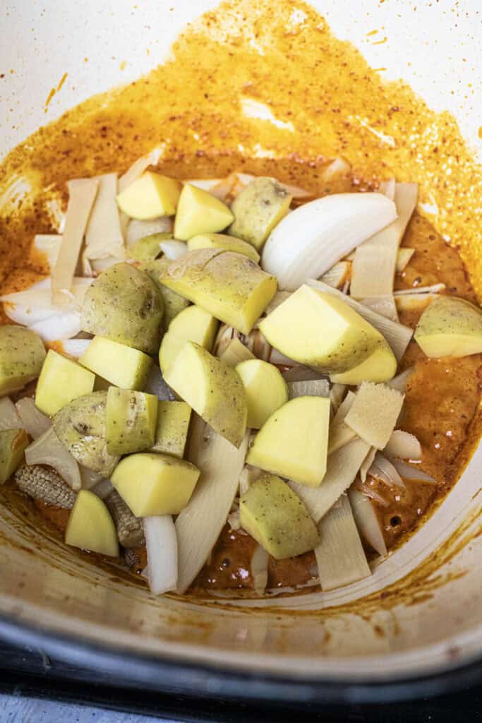 Vegetables with curry sauce in a pot.