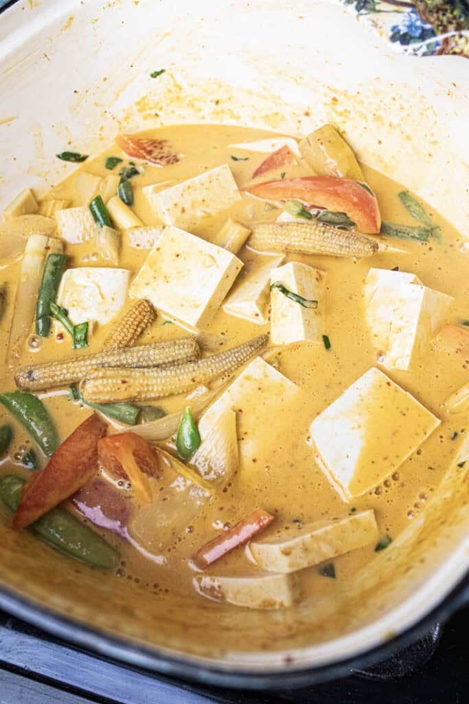 Thai red curry  tofu and vegetables in a pot.