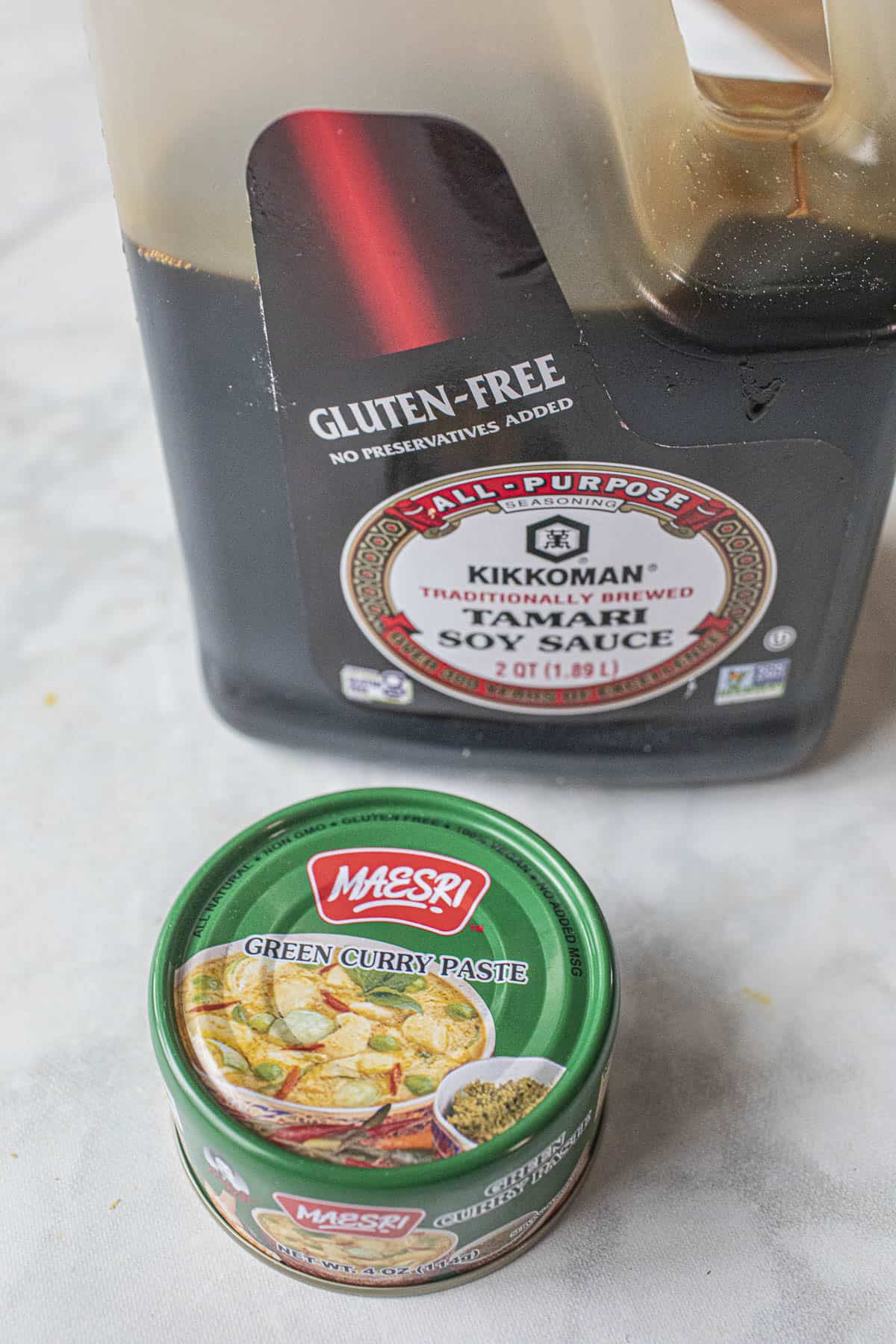 green curry paste and tamari soy sauce on a table. 