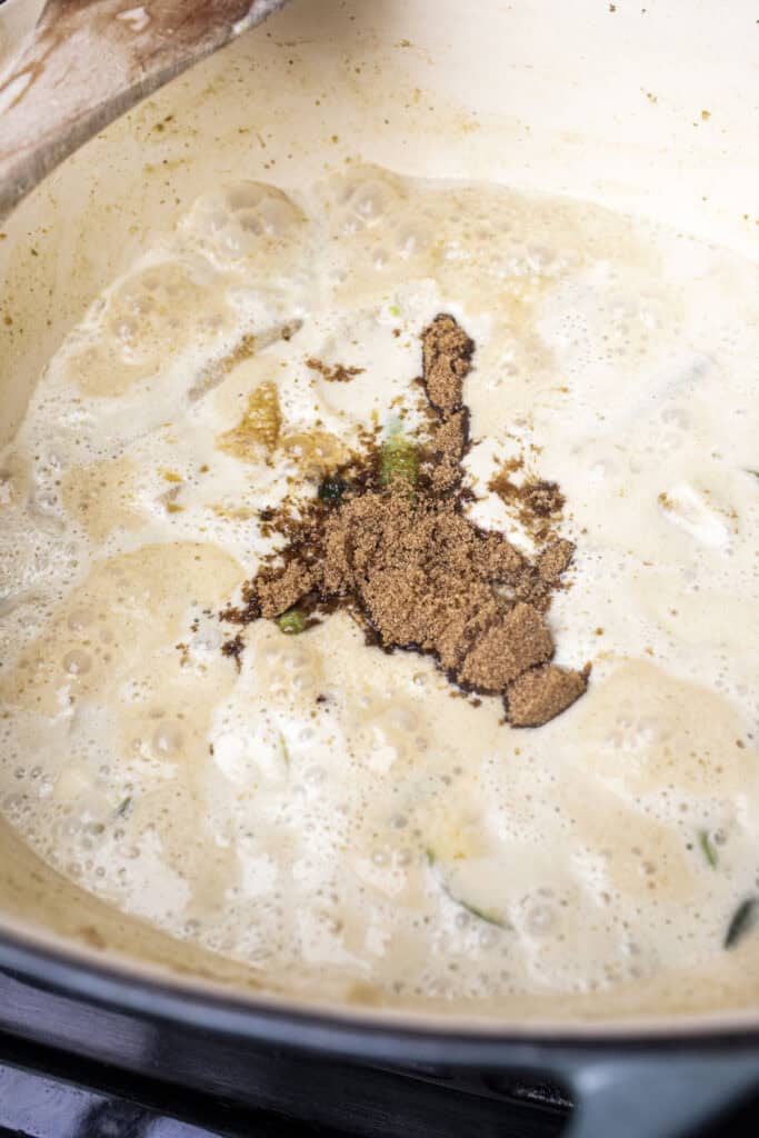 sugar on top of a curry broth.