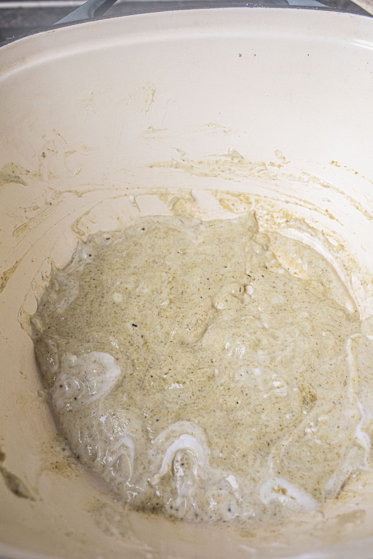 Green curry paste with coconut milk in a pot. 