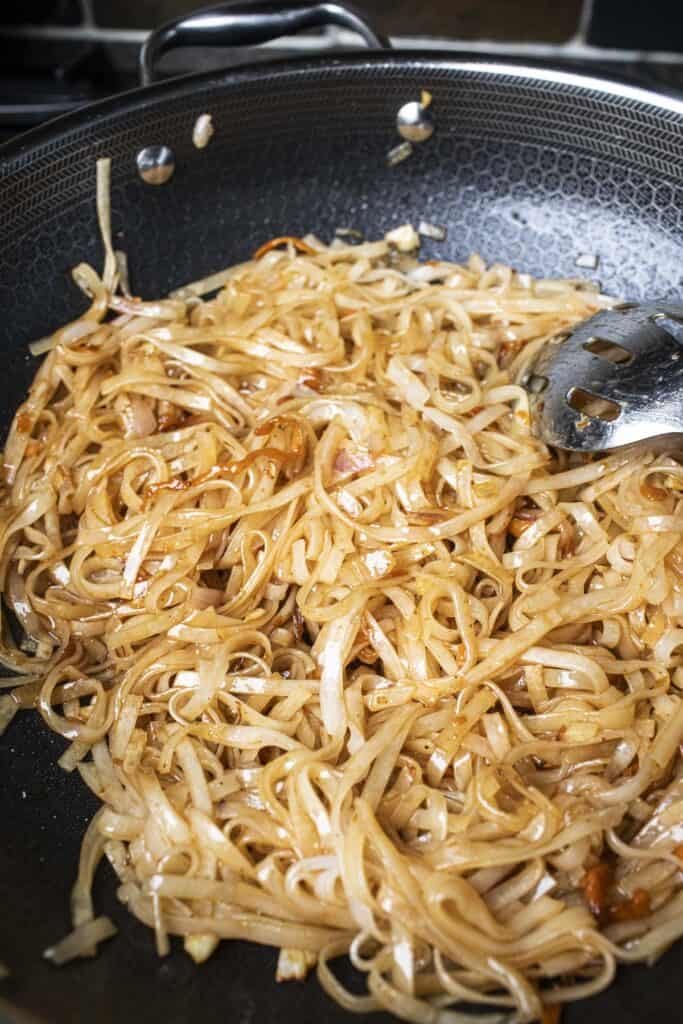 Pad Thai noodles in a wok.