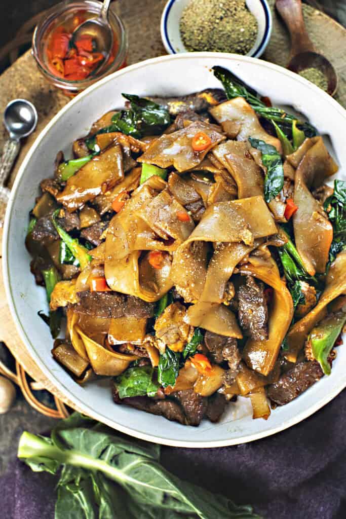Easy beef pad see ew with rice noodles on a plate. 