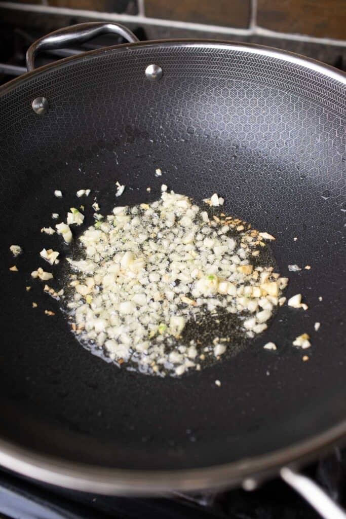 fried minced garlic in a wok. 