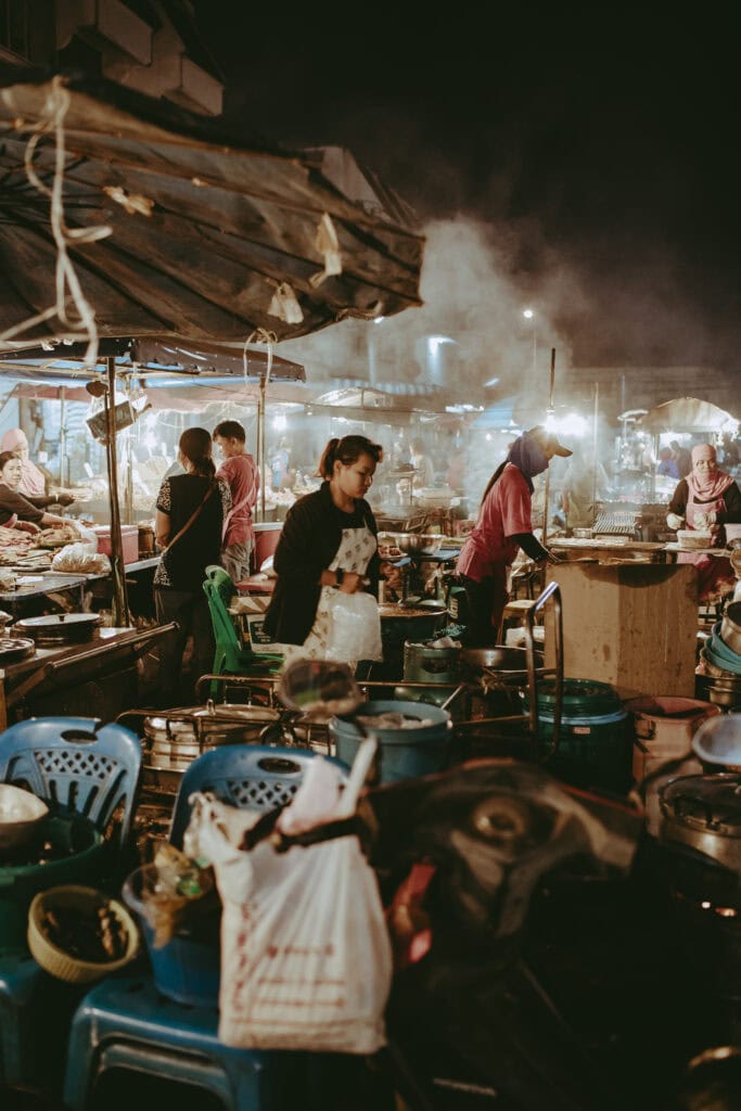 Thai people cooking during a night market.