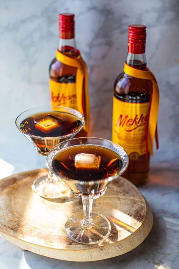 2 glasses of Mekhong whiskey cocktail on a tray.